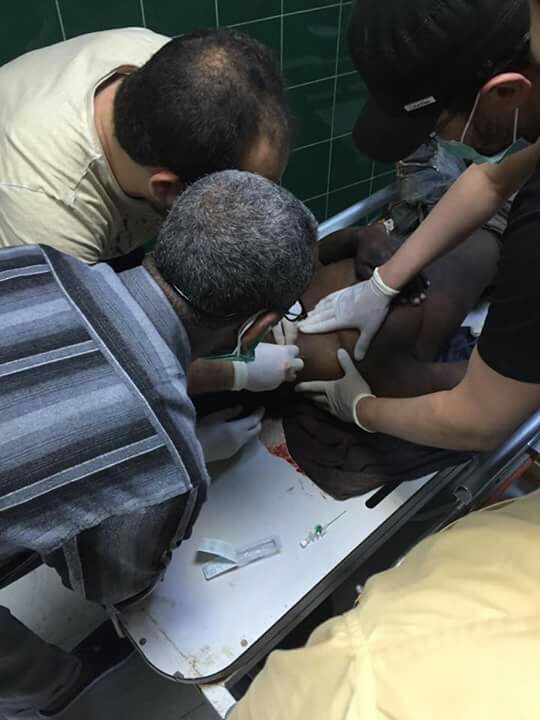 Medical staff and volunteers treating injured migrants at the Zawiya hospital.