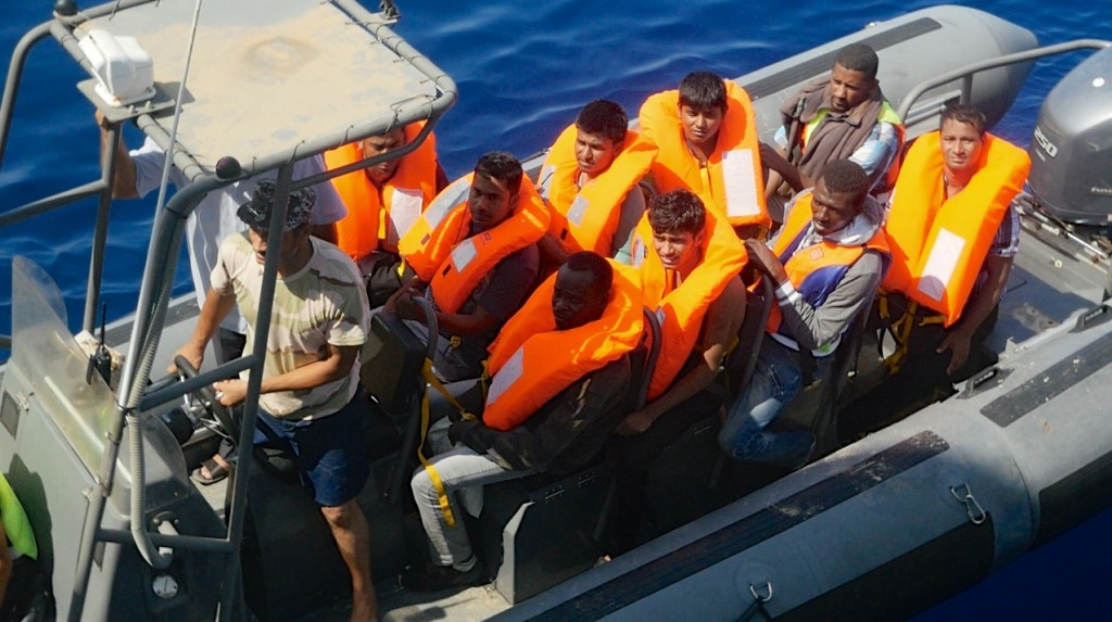 The Libyan coastguard assisting a rescue operation carried out by the Migrant Offshore Aid Station (MOAS) off Libyan waters. Photo: Moas.eu